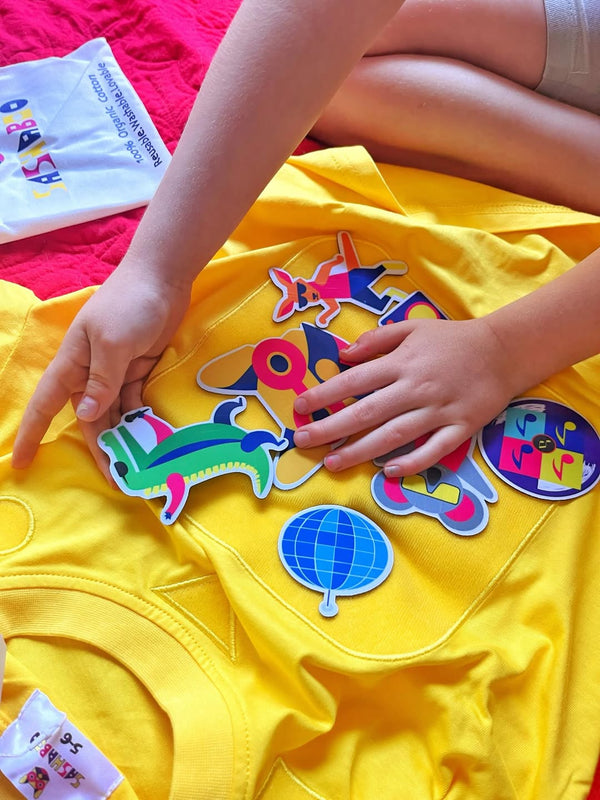 Child playing with Australian animal patches on interactive kids clothing