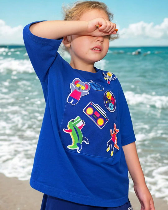 Child playing in a blue TeeBoo™ interactive kids T-shirt with the Aussie Animals Disco BooPatch™ set.