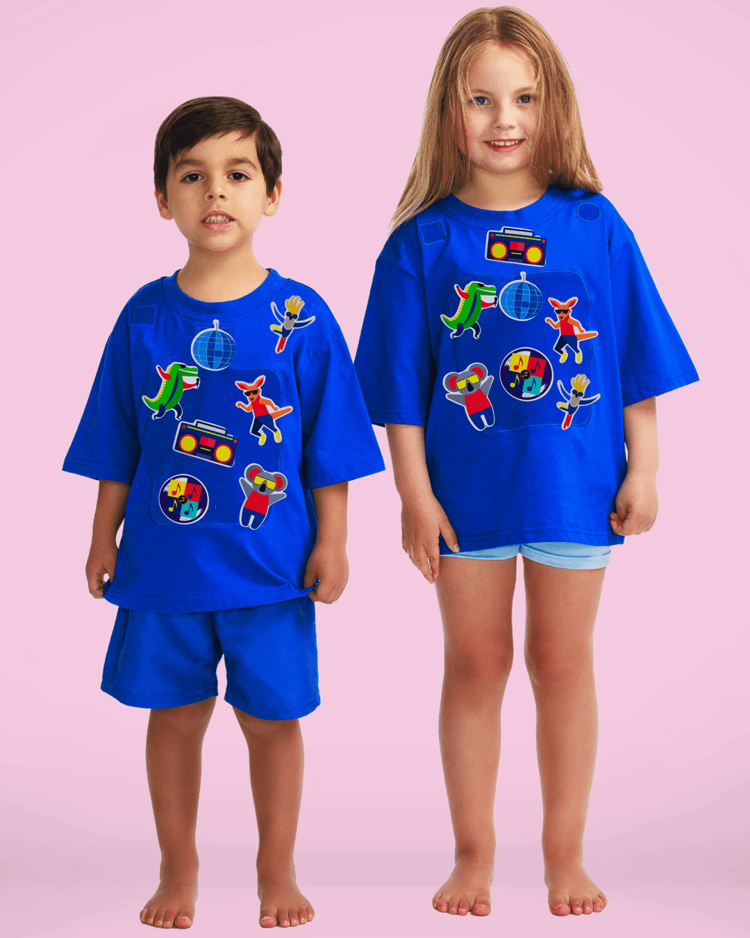 Boy and girl wearing blue TeeBoo™ interactive kids T-shirts with Sun.Fun.Surf. BooPatch™ premium gift-ready set.