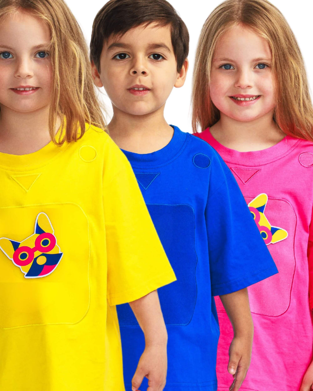 Three children wearing SASHABOO TeeBoo interactive T-shirts with reusable BooPatch patches for creative play