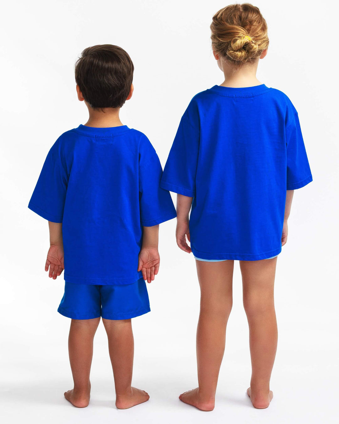 Back view of the blue TeeBoo™ oversized organic cotton kids T-shirt from the gift-ready set.