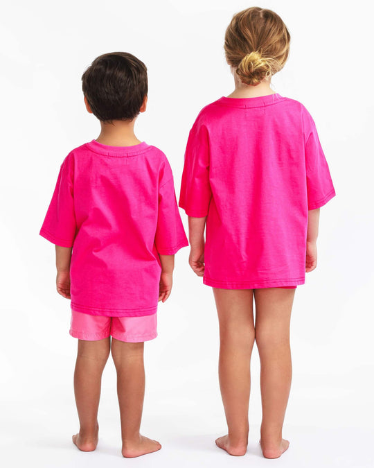 Back view of the pink TeeBoo™ oversized organic cotton kids T-shirt from the gift-ready set.