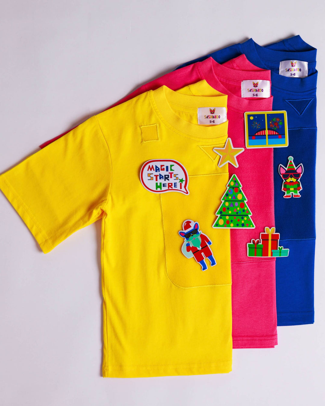 Yellow, pink and blue TeeBoo™ interactive T-shirts with reusable Christmas BooPatch™ designs – SashaBoo Christmas gift set