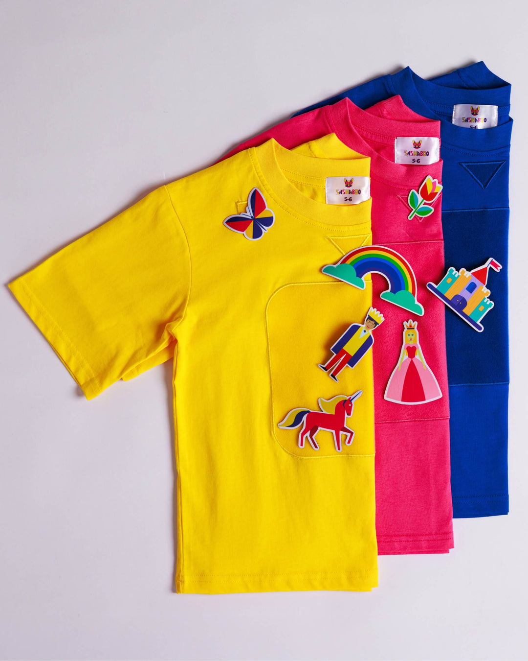 Yellow, blue and pink TeeBoo™ interactive kids T-shirts with the Fairy Sparkle BooPatch™ collection by SASHABOO.