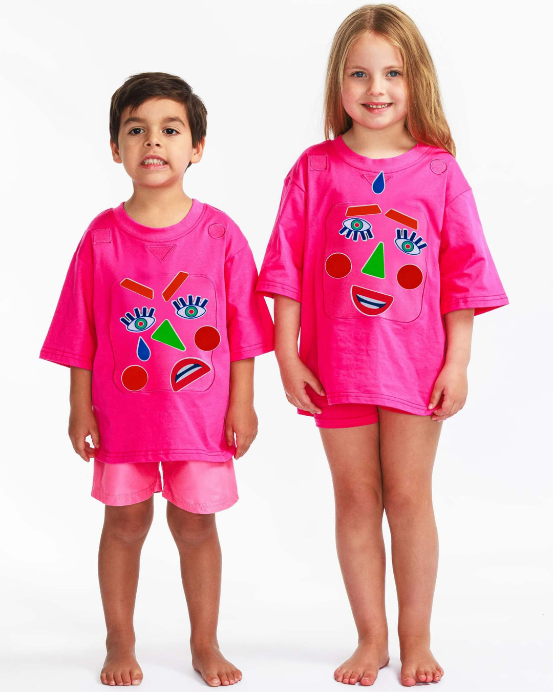 Boy and girl wearing a pink TeeBoo™ interactive kids T-shirt with the Moody Friends BooPatch™ gift-ready set for screen-free play.