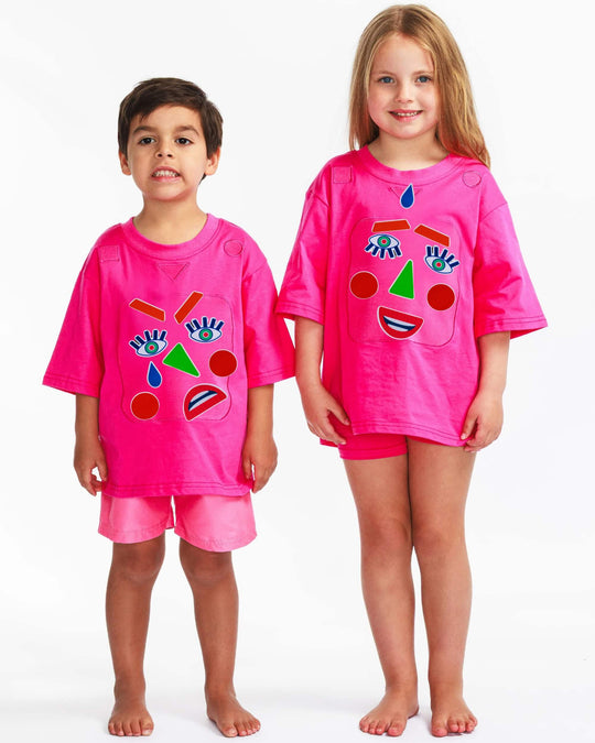 Boy and girl wearing a pink TeeBoo™ interactive kids T-shirt with the Moody Friends BooPatch™ gift-ready set for screen-free play.