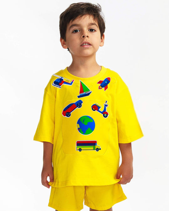 Boy wearing a yellow TeeBoo™ interactive kids T-shirt with the SpeedyBoo BooPatch™ gift-ready set for creative screen-free play.