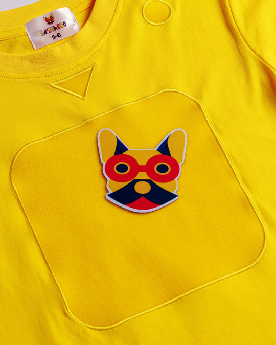 Close-up of the yellow TeeBoo™ interactive kids T-shirt featuring the signature French Bulldog patch by SASHABOO.