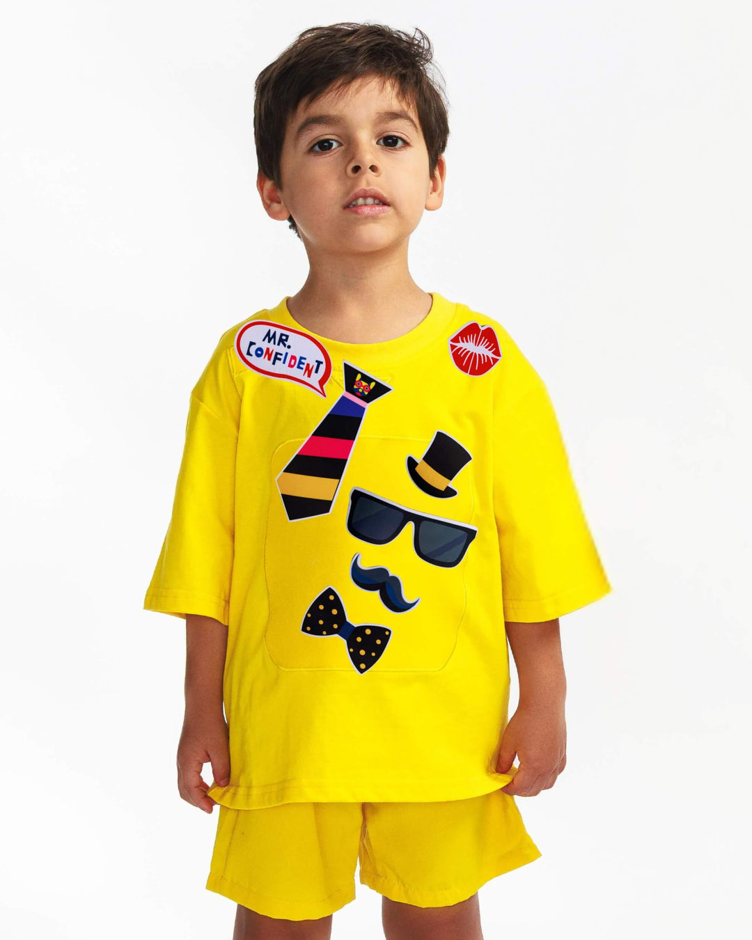 Boy wearing a yellow TeeBoo™ interactive kids T-shirt with the Mr. Confident BooPatch™ gift-ready set.