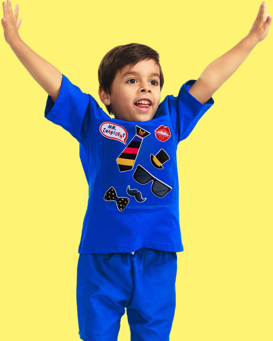 Child wearing blue TeeBoo™ Interactive Kids Gift Set with Mr. Confident BooPatch™ pieces for creative, sensory and screen-free play.