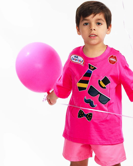 Boy wearing pink TeeBoo™ Interactive Kids Gift Set with Mr. Confident BooPatch™ pieces, premium gift-ready playwear by SASHABOO.
