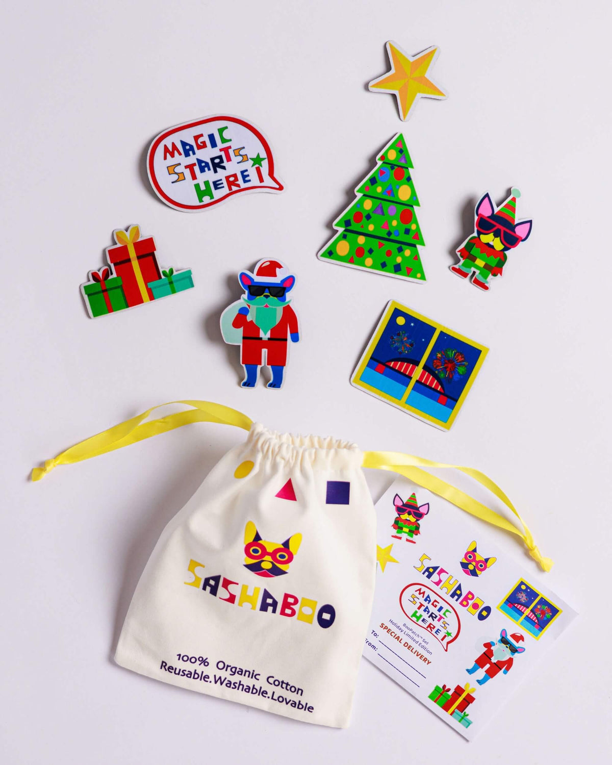 SASHABOO Christmas BooPatch set featuring colourful interchangeable Christmas tree, Santa, presents and festive patches, displayed with a reusable cotton storage bag and gift card.