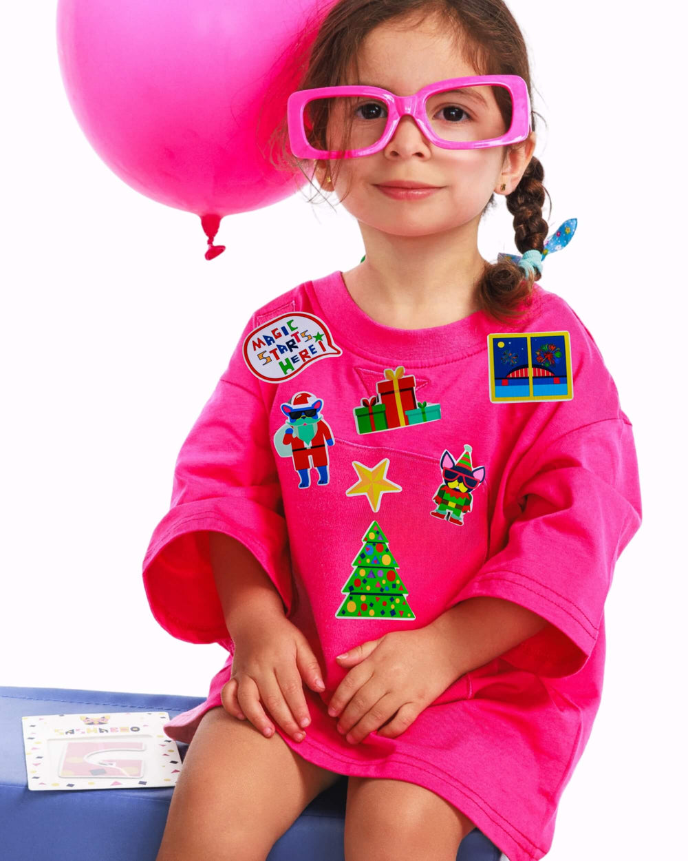 Girl wearing a pink TeeBoo™ interactive T-shirt with Christmas BooPatch™ set – SashaBoo festive gift set